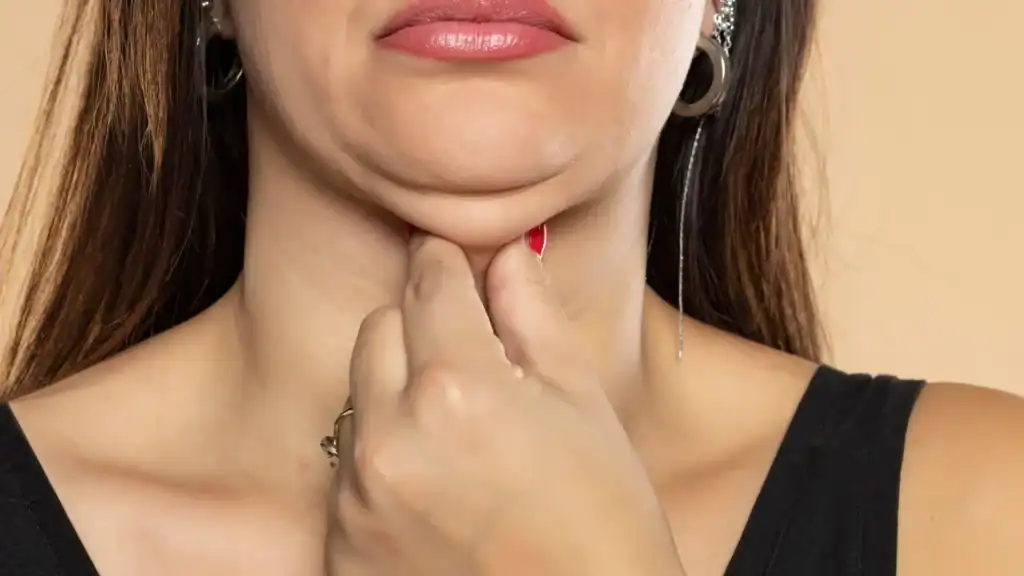 An image of a woman with double chin, sad, worried : Non Surgical Double Chin Removal Treatment in Torry, UK